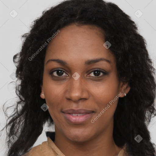 Joyful black young-adult female with long  brown hair and brown eyes