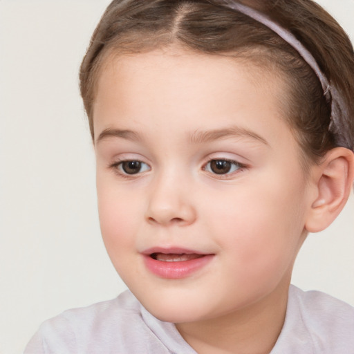 Joyful white child female with short  brown hair and brown eyes