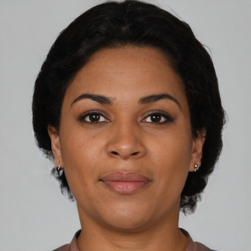 Joyful latino young-adult female with short  brown hair and brown eyes