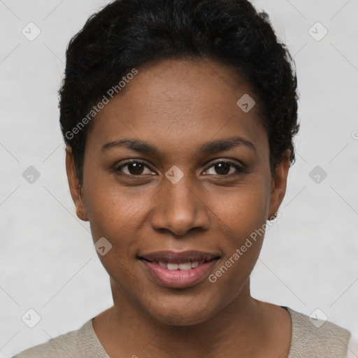 Joyful black young-adult female with short  black hair and brown eyes