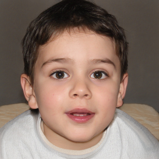 Joyful white child male with short  brown hair and brown eyes