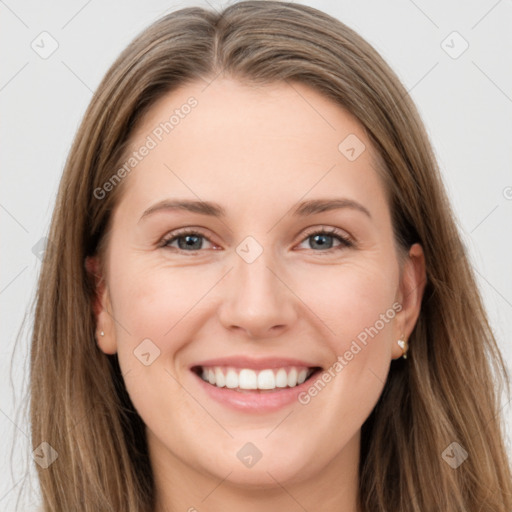 Joyful white young-adult female with long  brown hair and grey eyes