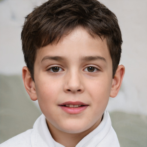 Joyful white child male with short  brown hair and brown eyes