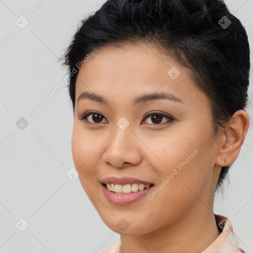 Joyful latino young-adult female with short  brown hair and brown eyes