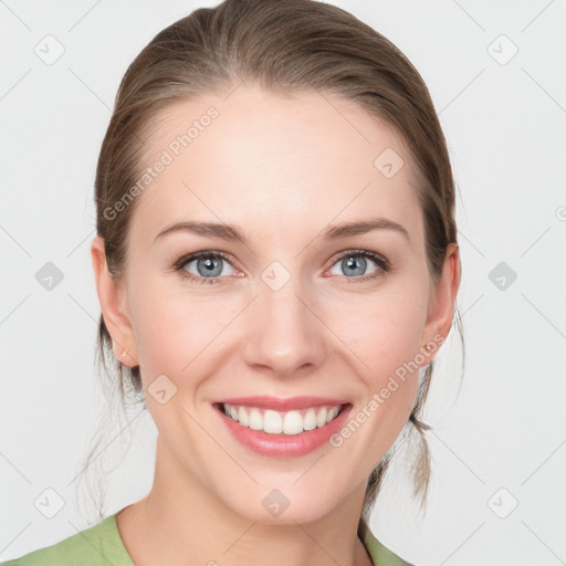 Joyful white young-adult female with medium  brown hair and blue eyes