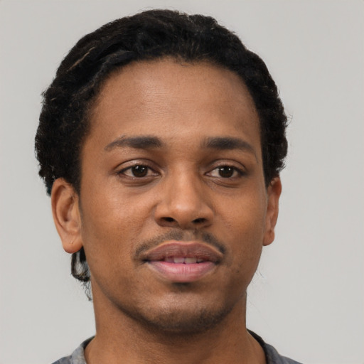 Neutral black young-adult male with short  brown hair and brown eyes
