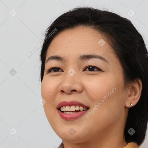 Joyful asian young-adult female with medium  brown hair and brown eyes