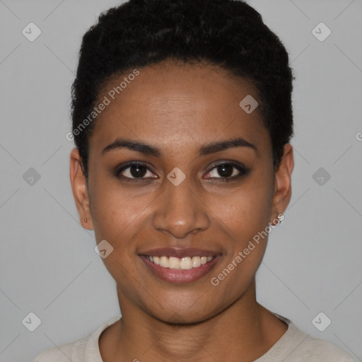 Joyful black young-adult female with short  black hair and brown eyes