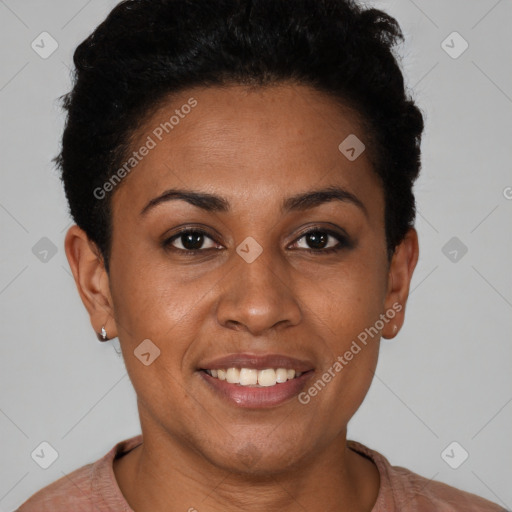 Joyful black young-adult female with short  brown hair and brown eyes