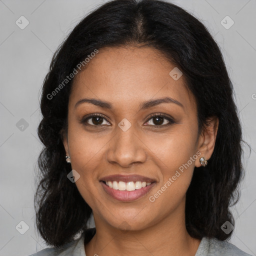 Joyful black young-adult female with long  brown hair and brown eyes