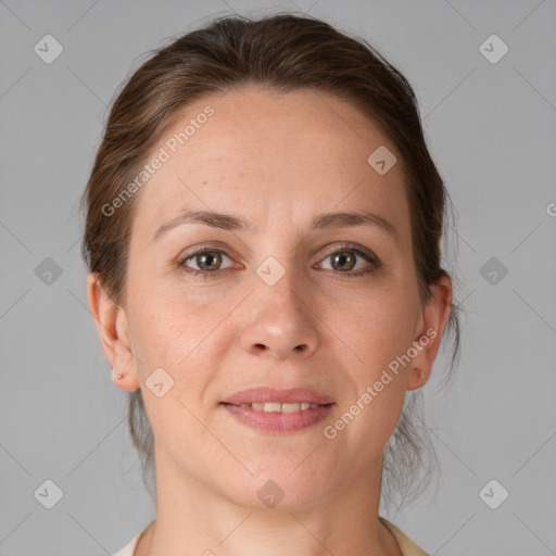 Joyful white adult female with medium  brown hair and grey eyes