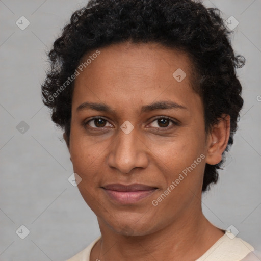 Joyful black adult female with short  brown hair and brown eyes