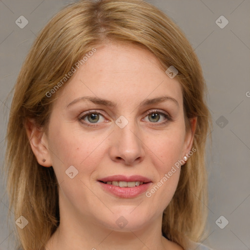 Joyful white adult female with medium  brown hair and blue eyes