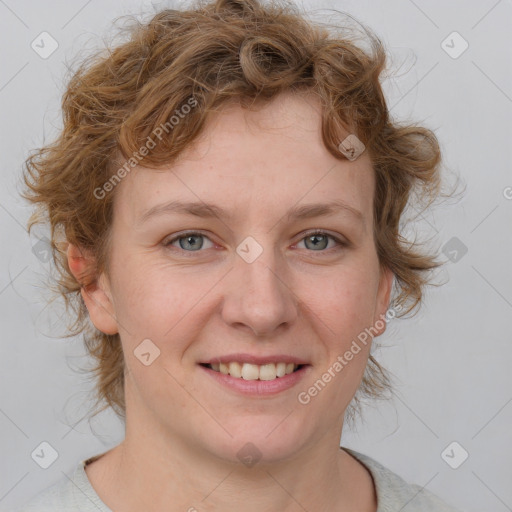 Joyful white young-adult female with medium  brown hair and blue eyes