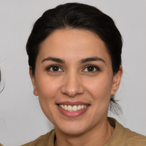 Joyful white young-adult female with medium  brown hair and brown eyes