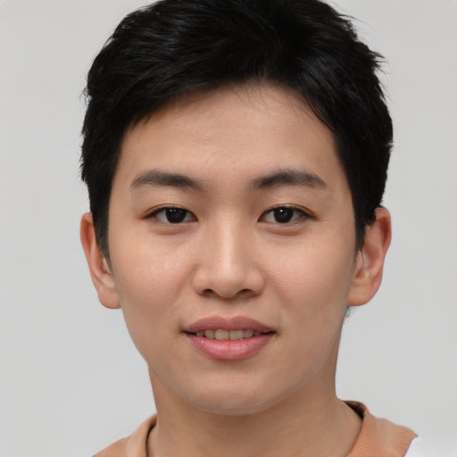 Joyful asian young-adult female with short  black hair and brown eyes