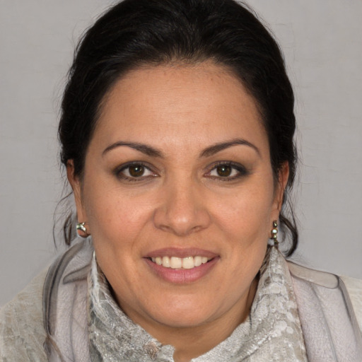 Joyful white adult female with medium  brown hair and brown eyes