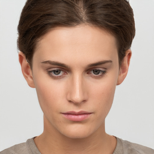 Neutral white young-adult female with short  brown hair and brown eyes