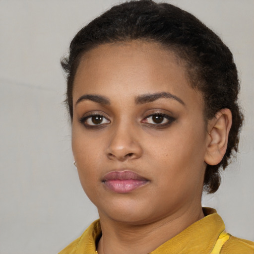 Neutral black young-adult female with short  brown hair and brown eyes