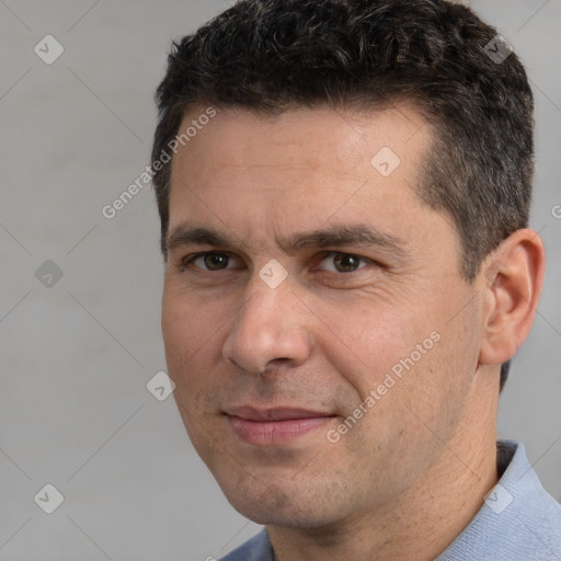 Joyful white adult male with short  brown hair and brown eyes