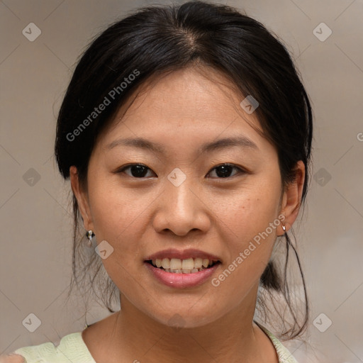 Joyful asian young-adult female with medium  brown hair and brown eyes