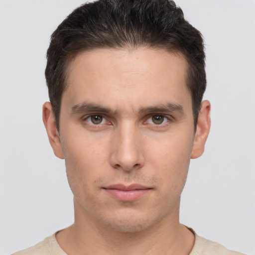 Neutral white young-adult male with short  brown hair and brown eyes