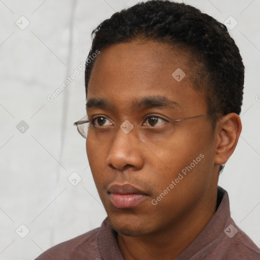 Neutral black young-adult male with short  black hair and brown eyes