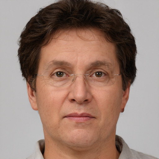 Joyful white middle-aged male with short  brown hair and brown eyes