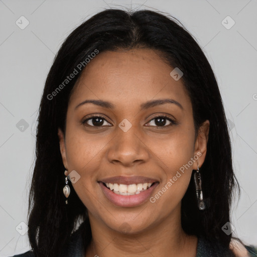 Joyful black young-adult female with long  brown hair and brown eyes