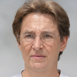 Joyful white middle-aged male with short  brown hair and brown eyes