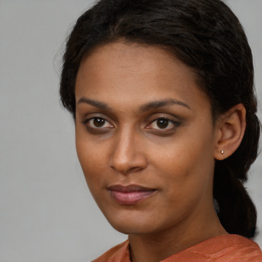 Neutral black young-adult female with short  black hair and brown eyes