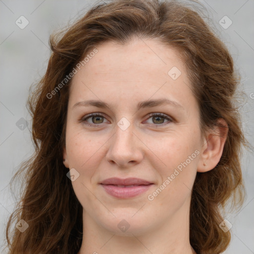 Joyful white young-adult female with long  brown hair and green eyes