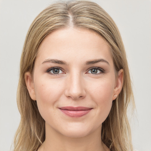 Joyful white young-adult female with long  brown hair and grey eyes