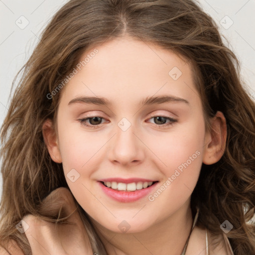 Joyful white young-adult female with long  brown hair and green eyes