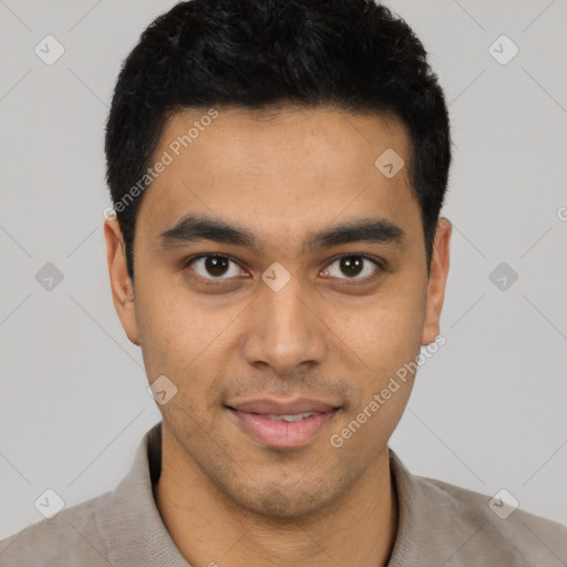 Joyful latino young-adult male with short  black hair and brown eyes