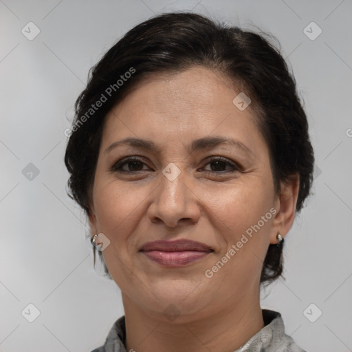 Joyful white adult female with medium  brown hair and brown eyes