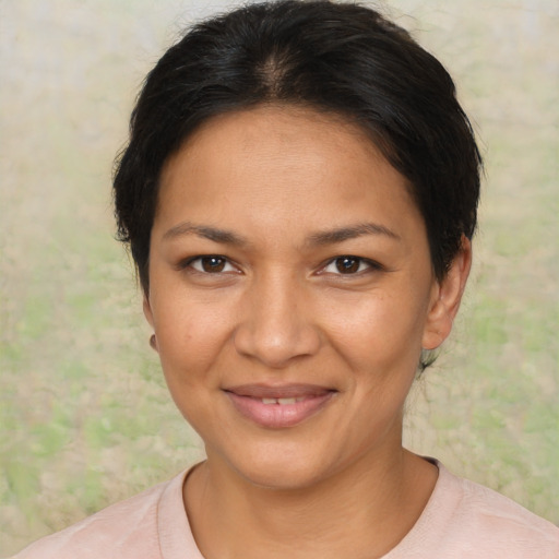 Joyful latino young-adult female with short  brown hair and brown eyes