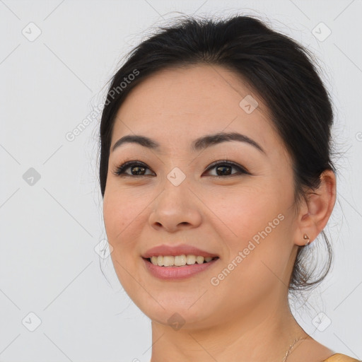 Joyful asian young-adult female with long  brown hair and brown eyes