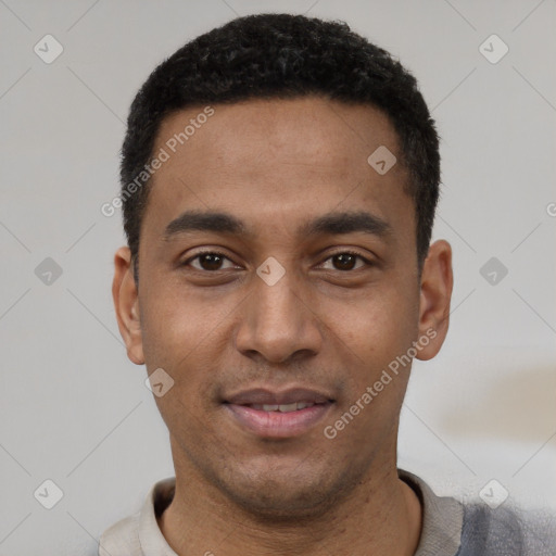 Joyful latino young-adult male with short  black hair and brown eyes