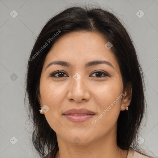 Joyful latino young-adult female with medium  brown hair and brown eyes