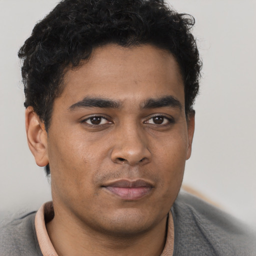 Neutral latino young-adult male with short  brown hair and brown eyes