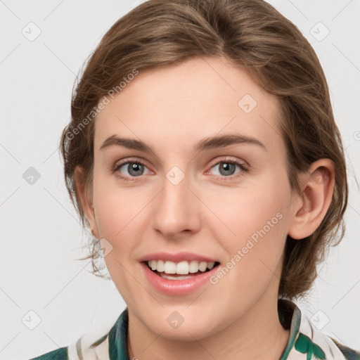 Joyful white young-adult female with medium  brown hair and green eyes