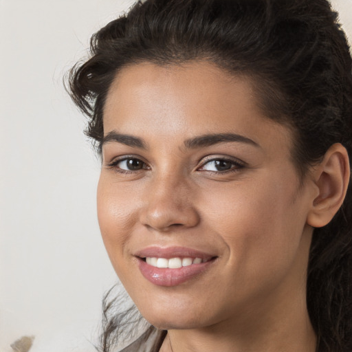 Joyful white young-adult female with long  brown hair and brown eyes