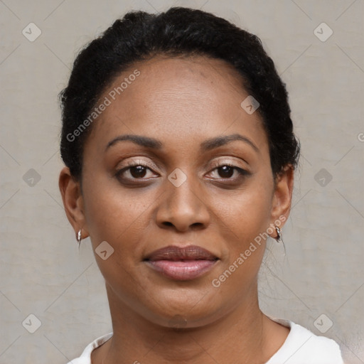 Joyful black young-adult female with short  brown hair and brown eyes