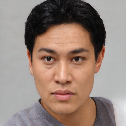 Neutral asian adult male with short  black hair and brown eyes