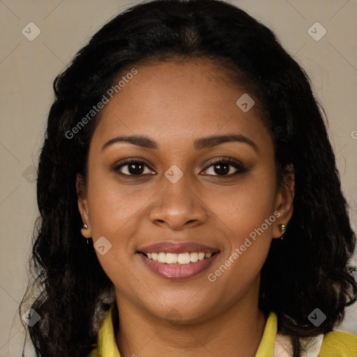 Joyful black young-adult female with long  brown hair and brown eyes