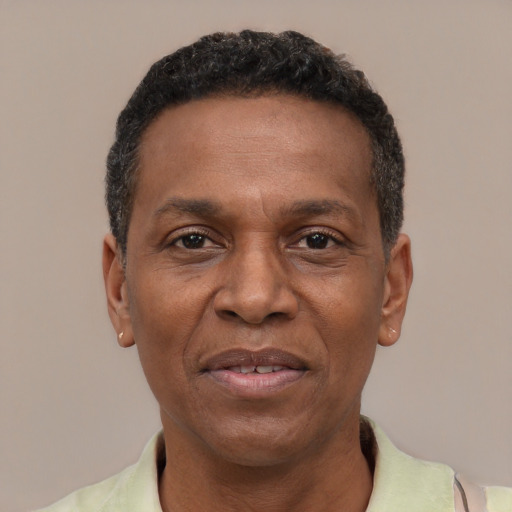 Joyful latino adult male with short  black hair and brown eyes