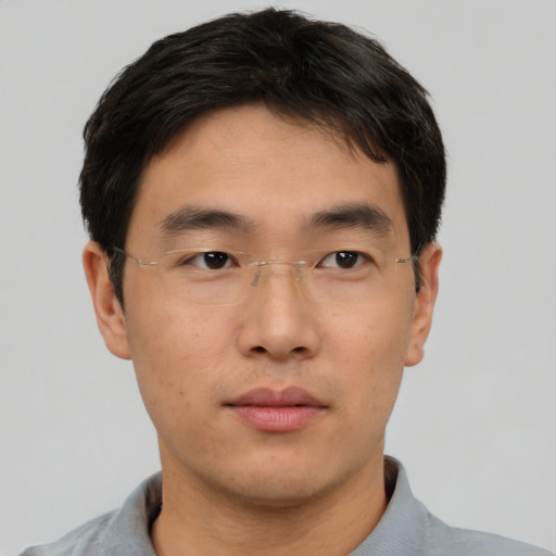 Neutral asian young-adult male with short  brown hair and brown eyes