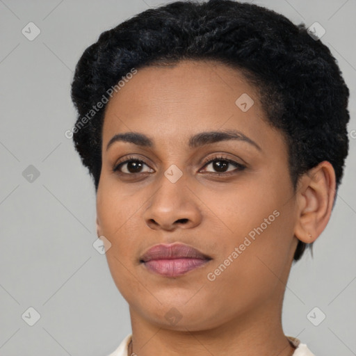 Joyful black young-adult female with short  black hair and brown eyes