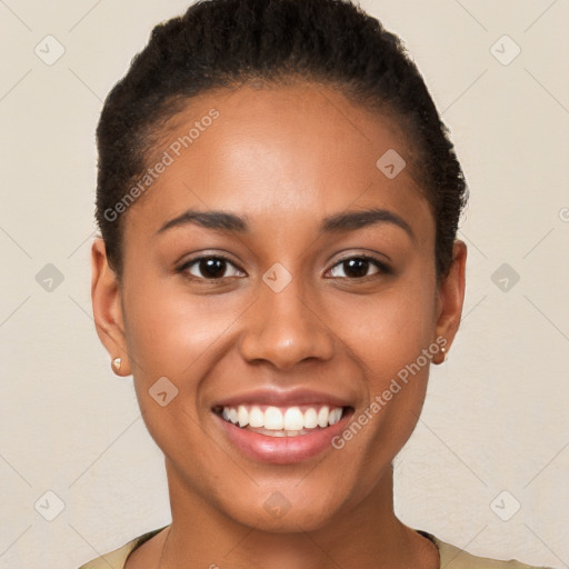 Joyful latino young-adult female with short  brown hair and brown eyes